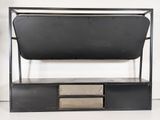 a black metal shelf with two drawers underneath it