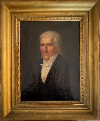 portrait of a man in a black coat and white shirt