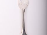 a silver fork and a silver spoon on a white surface