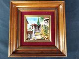 framed picture of a painting of a courtyard with a fountain
