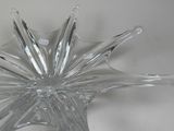 a clear glass bowl with a star shaped design on it