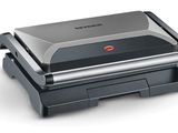 a close up of a sandwich maker on a white surface