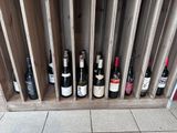 many bottles of wine sitting in a wooden crate