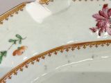 a close up of a plate with flowers on it