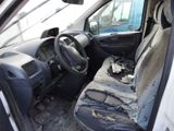 a car that has been vandalized and is sitting on the floor