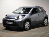 the toyota c - hr is parked in a room with a checkered floor