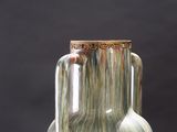 a glass vase that is sitting on a table