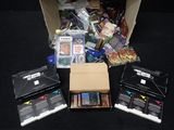 a box full of cards and other items on the floor
