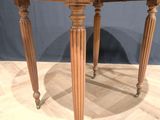 a wooden table with a wooden top on a wooden floor