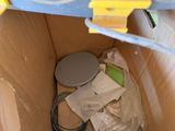 a cardboard box with a toilet inside of it