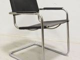 an image of a chair with a black leather seat
