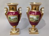 pair of antique vases with hand painted scenes on them