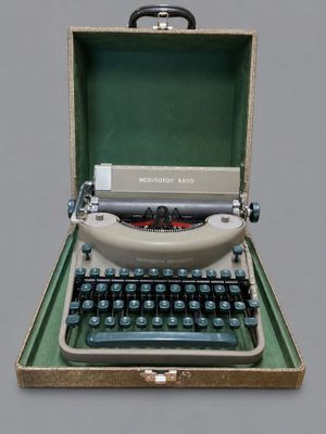 an old typewriter sitting in a case on a table