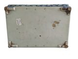 an old suitcase with a tag on it sitting on a white surface