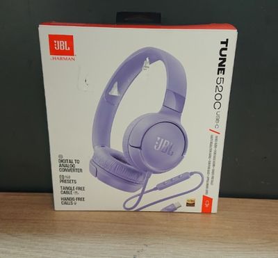 the box of a pair of headphones is sitting on a table