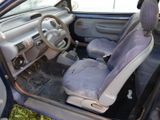 the interior of a car with a dirty seat and steering wheel