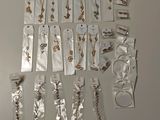 many pieces of jewelry on display on the table