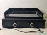 a black stove with two burners on top of it
