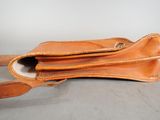 an image of a brown leather bag with a long strap