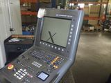an image of a machine in a factory with a large screen