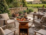 a fire pit sitting in the middle of a patio