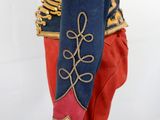 an image of a blue and red jacket with gold trims