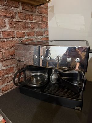 a coffee machine sitting on a counter in a kitchen