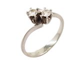 a close up of a diamond ring on a white background