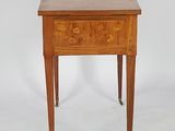 a small wooden table with a drawer on top of it