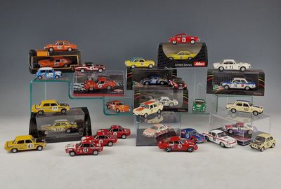 a lot of toy cars on display in a display case