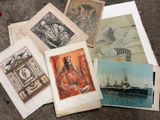 a lot of old postcards sitting on the ground
