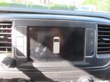 a picture of a car dashboard with a cell phone in it