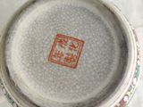 a close up of a vase on a table