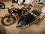a motorcycle with a side car attached to it