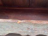 a wooden bench that has been painted blue and brown