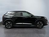 the black suv is parked in a room with a white wall