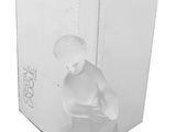 the figurine of a man is sitting on a white base