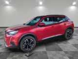 a red 2020 toyota c - hr suv parked in a garage