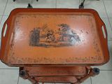 a tray with a picture on it sitting on a stand
