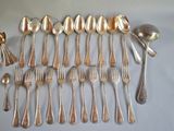 a lot of silver spoons and spoon spoons on a table