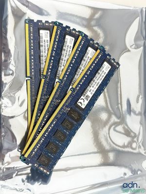four memory modules are sitting on top of a plastic bag