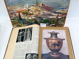 an open book with a picture of a vase and a picture of a city