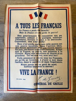 an old french newspaper on a wooden table with a french flag