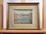 une peinture à l'huile représentant une vue sur un lac, encadrée et posée sur une étagère