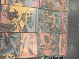 a lot of comic books on the wall in the bathroom