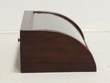 a small wooden desk with a glass top on it