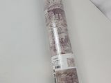 a close up of a roll of paper on a white surface