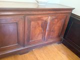 a wooden cabinet with a bowl on top of it