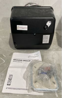 a black suitcase sitting on the floor next to a package of items