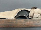 a close up of a gun with a canvas pouch on it